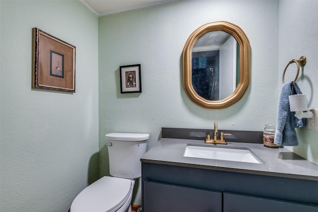 bathroom featuring toilet and vanity