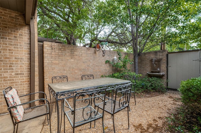 view of patio / terrace with outdoor dining area and fence