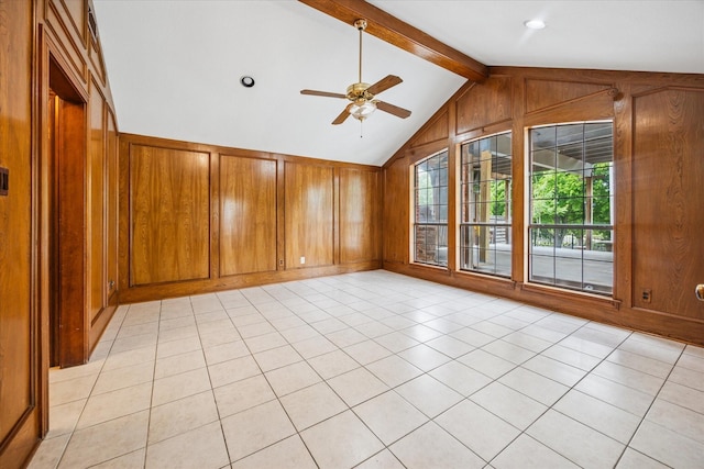 845 Canyon Crest Dr, Irving, TX 75063 - empty room with light tile patterned flooring, a ceiling fan, vaulted ceiling with beams, and wooden walls