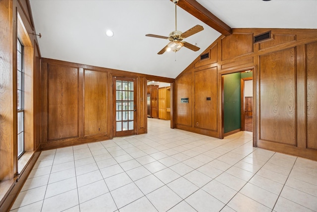 845 Canyon Crest Dr, Irving, TX 75063 - spare room with vaulted ceiling with beams, visible vents, wooden walls, and ceiling fan