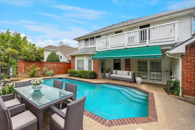 845 Canyon Crest Dr, Irving, TX 75063 - rear view of house featuring a fenced in pool, fence, a patio area, a balcony, and an outdoor living space