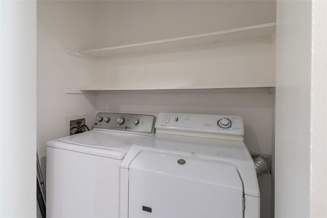 washroom with washer and clothes dryer and laundry area