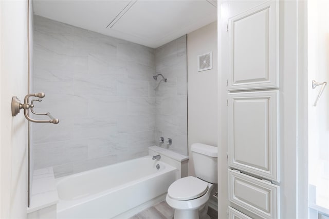 full bath featuring visible vents, toilet, and shower / washtub combination