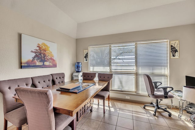 dining space with tile patterned flooring