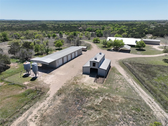 drone / aerial view featuring a forest view