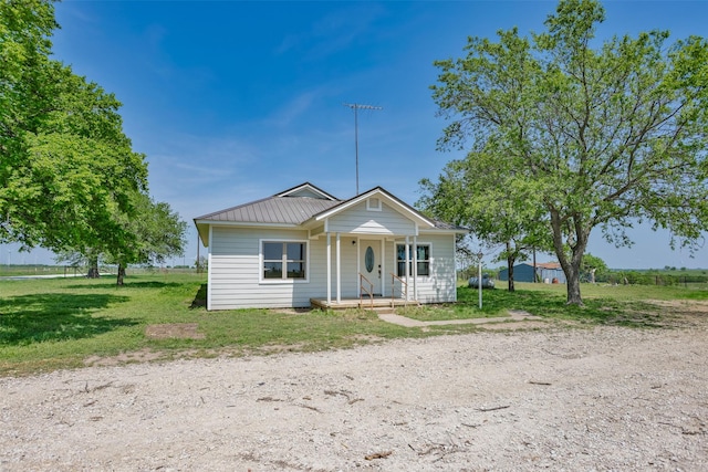 1754 County Road 427, Muenster, TX 76252 - bungalow-style home featuring metal roof, a front yard, and covered porch
