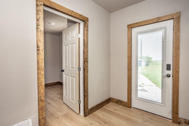 1754 County Road 427, Muenster, TX 76252 - entryway with visible vents, baseboards, and light wood-style floors