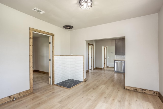 1754 County Road 427, Muenster, TX 76252 - empty room featuring light wood-style floors, visible vents, and baseboards