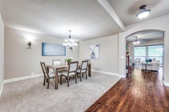 11529 Penick Way, Frisco, TX 75033 - carpeted dining space featuring arched walkways, a chandelier, baseboards, and a ceiling fan