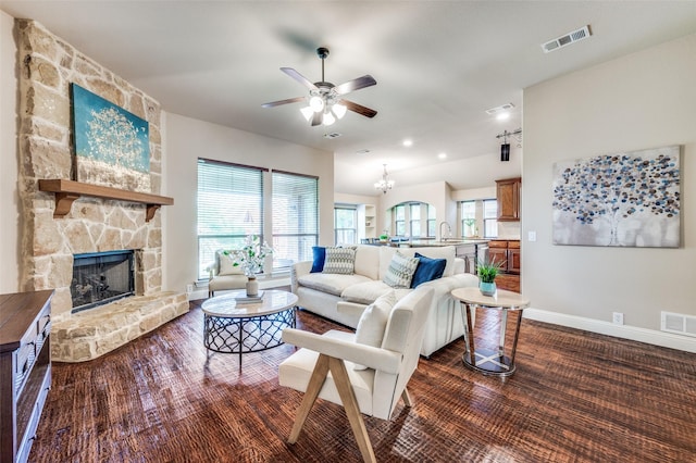 11529 Penick Way, Frisco, TX 75033 - living area featuring a ceiling fan, baseboards, a stone fireplace, dark wood-type flooring, and recessed lighting