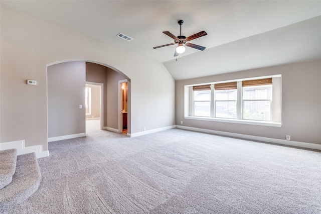 11529 Penick Way, Frisco, TX 75033 - carpeted empty room featuring lofted ceiling, arched walkways, ceiling fan, and baseboards