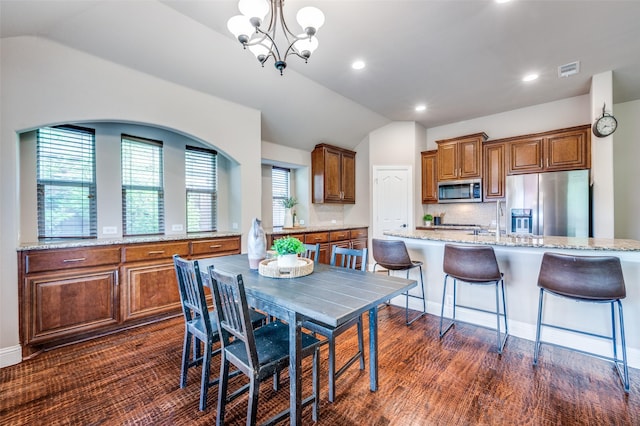 11529 Penick Way, Frisco, TX 75033 - dining space featuring lofted ceiling, a chandelier, recessed lighting, and dark wood-style floors