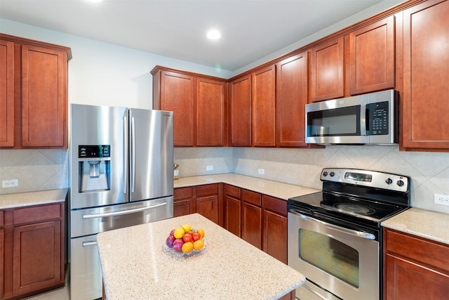 5720 Rubblestone Dr, Mckinney, TX 75070 - kitchen with appliances with stainless steel finishes, tasteful backsplash, light stone counters, a kitchen island, and recessed lighting