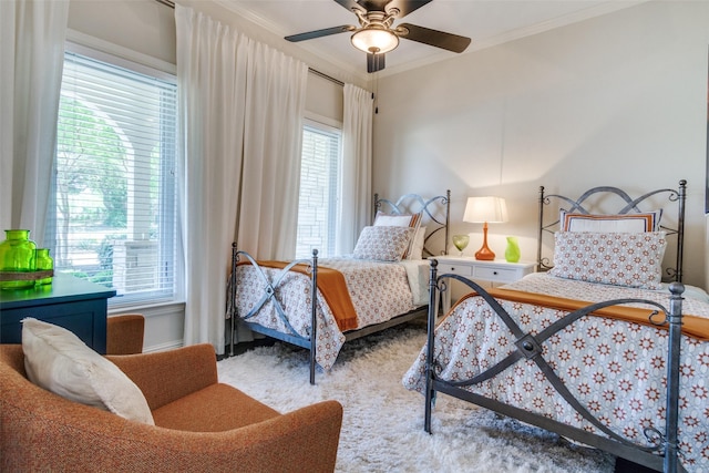 105 Bay Hill Dr, Graford, TX 76449 - carpeted bedroom with crown molding and ceiling fan
