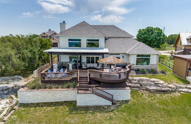 back of house featuring a wooden deck, a lawn, a fenced backyard, and an outdoor living space