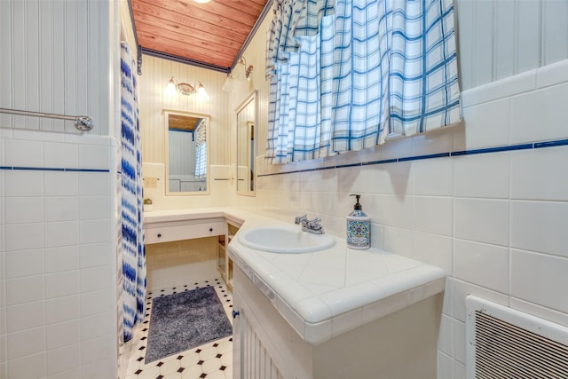 1182 County Road 3025, Bonham, TX 75418 - bathroom with decorative backsplash, vanity, tile walls, wooden ceiling, and visible vents