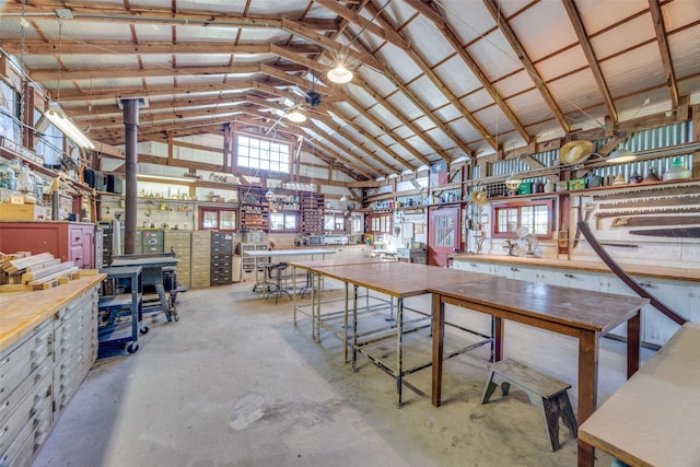 1182 County Road 3025, Bonham, TX 75418 - misc room featuring concrete flooring, high vaulted ceiling, and a workshop area