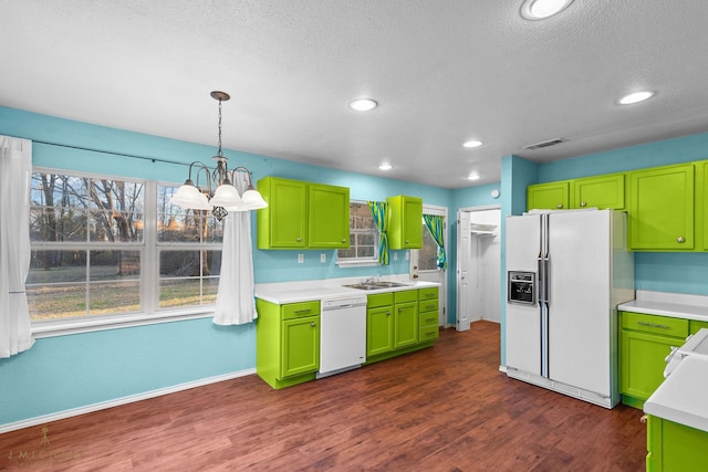 5663 Bretwood Dr, Keithville, LA 71047 - kitchen with an inviting chandelier, light countertops, visible vents, a sink, and white appliances