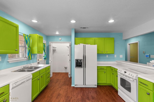 5663 Bretwood Dr, Keithville, LA 71047 - kitchen featuring a sink, dark wood-style flooring, visible vents, white appliances, and light countertops