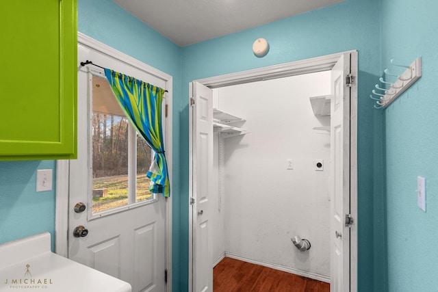 5663 Bretwood Dr, Keithville, LA 71047 - doorway with baseboards and wood finished floors
