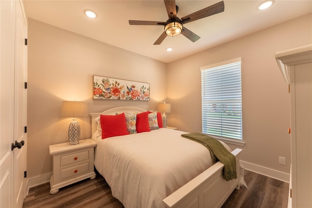 bedroom with dark wood-type flooring, baseboards, and recessed lighting