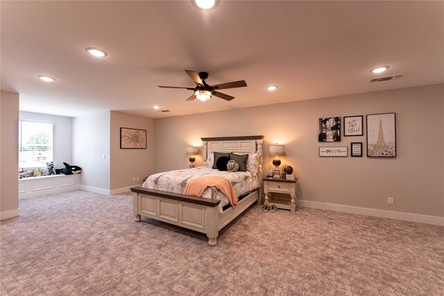 bedroom with ceiling fan, light colored carpet, baseboards, visible vents, and recessed lighting