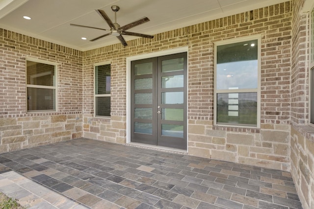 view of patio featuring ceiling fan and french doors
