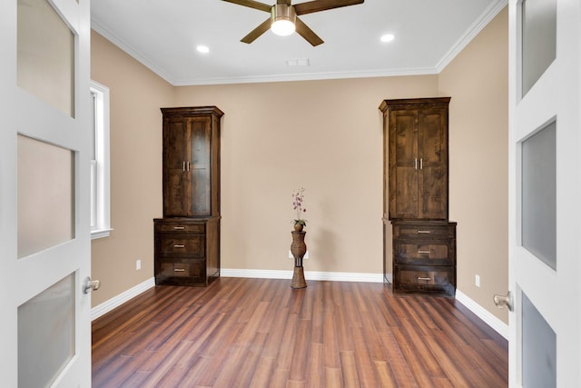 interior space featuring recessed lighting, wood finished floors, crown molding, and baseboards