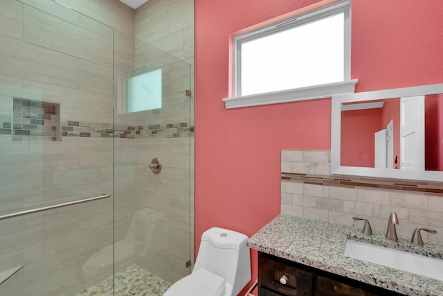 full bathroom with backsplash, a textured wall, toilet, vanity, and a stall shower