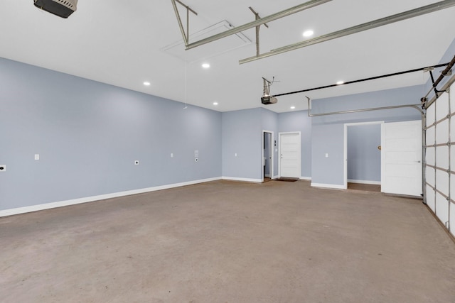 garage with recessed lighting, baseboards, and a garage door opener
