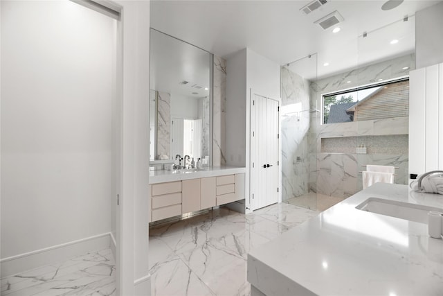 1124 Paradise Cv, Streetman, TX 75859 - bathroom with a marble finish shower, vanity, marble finish floor, baseboards, and visible vents