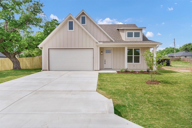 craftsman inspired home with roof with shingles, driveway, fence, a garage, and board and batten siding