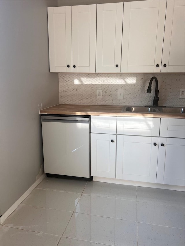 704 N Tennessee St, Mckinney, TX 75069 - kitchen featuring white cabinets, tasteful backsplash, dishwasher, and a sink