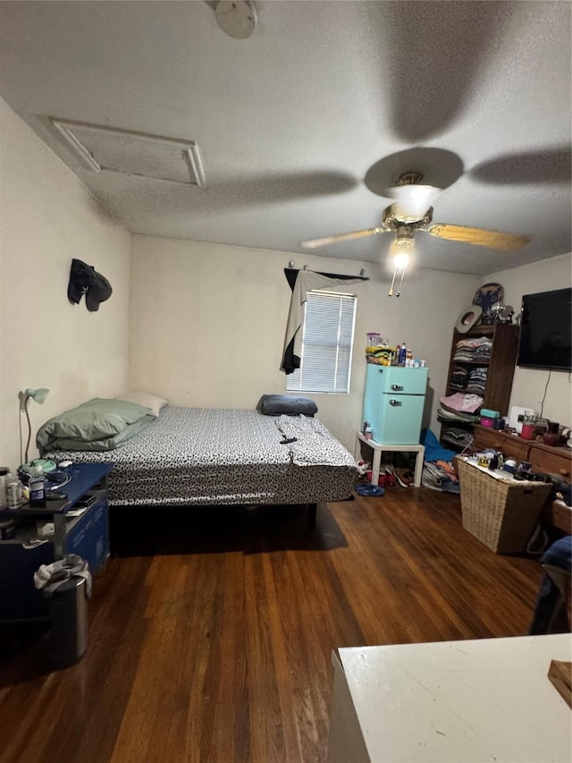 704 N Tennessee St, Mckinney, TX 75069 - bedroom featuring attic access, wood finished floors, and ceiling fan