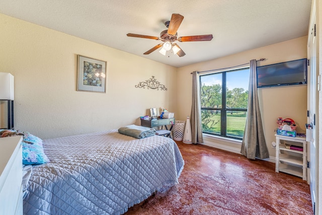 bedroom featuring finished concrete flooring and ceiling fan