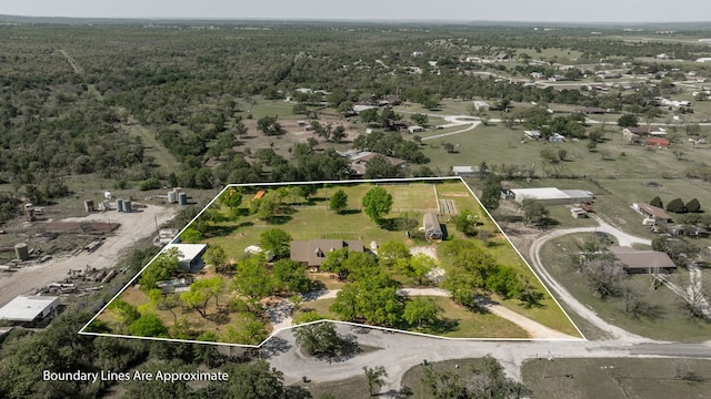 drone / aerial view with a view of trees