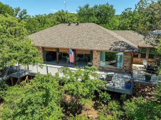1780 S Lakeview Dr, Gordon, TX 76453 - back of house featuring a deck, a shingled roof, and brick siding