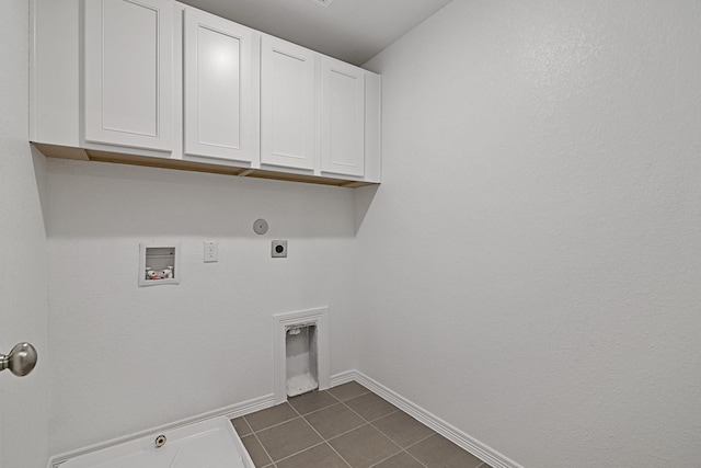 laundry room with electric dryer hookup, cabinet space, hookup for a gas dryer, and washer hookup