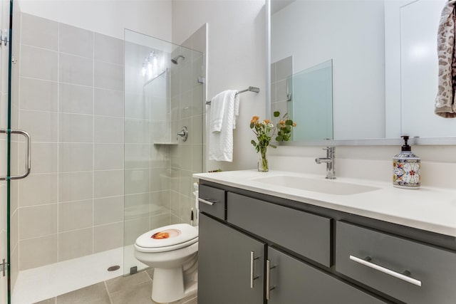 7320 Collin Mckinney Pkwy, Mckinney, TX 75070 - full bathroom with a shower stall, toilet, vanity, and tile patterned floors