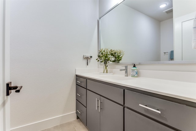 7320 Collin Mckinney Pkwy, Mckinney, TX 75070 - bathroom with baseboards, visible vents, tile patterned flooring, and vanity