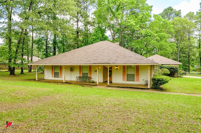 3873 Talton St, Shreveport, LA 71119 - country-style home with a porch, a shingled roof, and a front yard