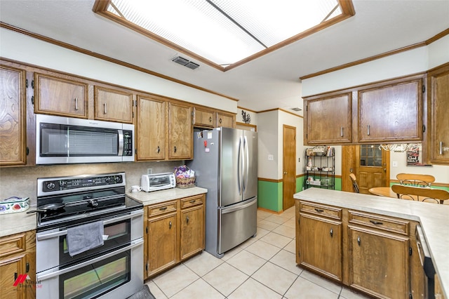3873 Talton St, Shreveport, LA 71119 - kitchen featuring light tile patterned floors, stainless steel appliances, light countertops, ornamental molding, and visible vents