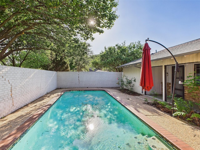 view of pool with a fenced backyard and a fenced in pool