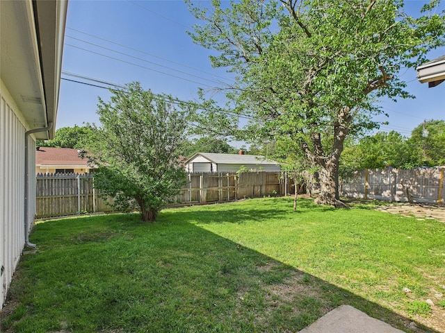 view of yard with a fenced backyard