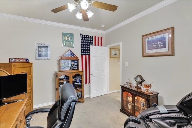 home office with crown molding, baseboards, ceiling fan, and light carpet