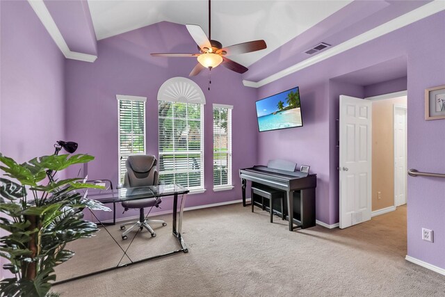 home office featuring ceiling fan, visible vents, vaulted ceiling, carpet floors, and baseboards