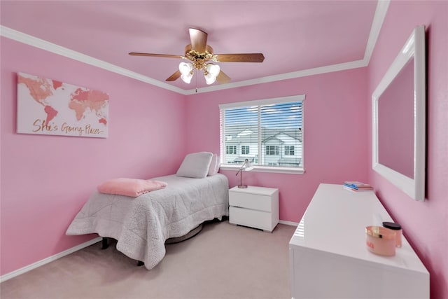 bedroom with crown molding, baseboards, light carpet, and a ceiling fan