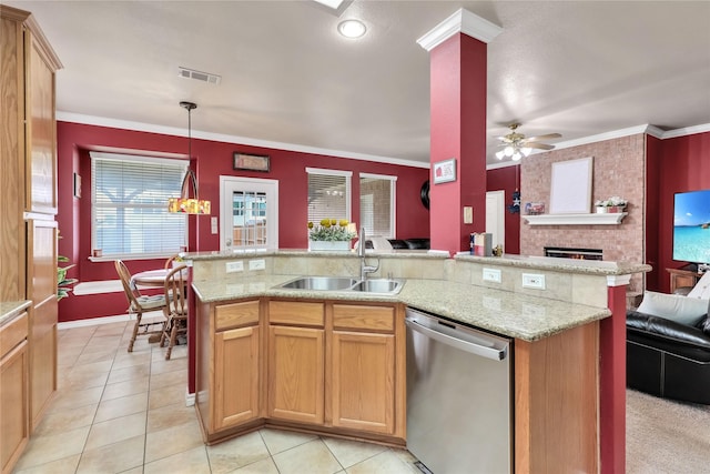 kitchen with a sink, dishwasher, a brick fireplace, open floor plan, and visible vents