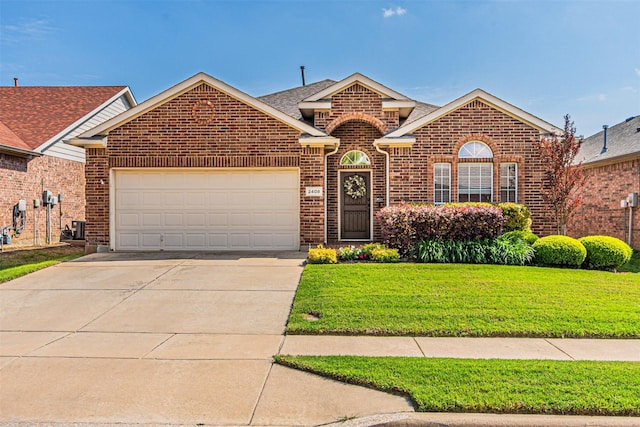 ranch-style house featuring concrete driveway, brick siding, a front yard, and a garage