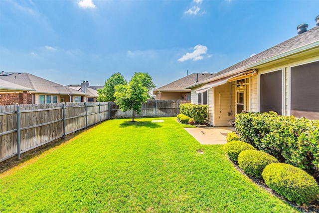 view of yard featuring a patio area and a fenced backyard